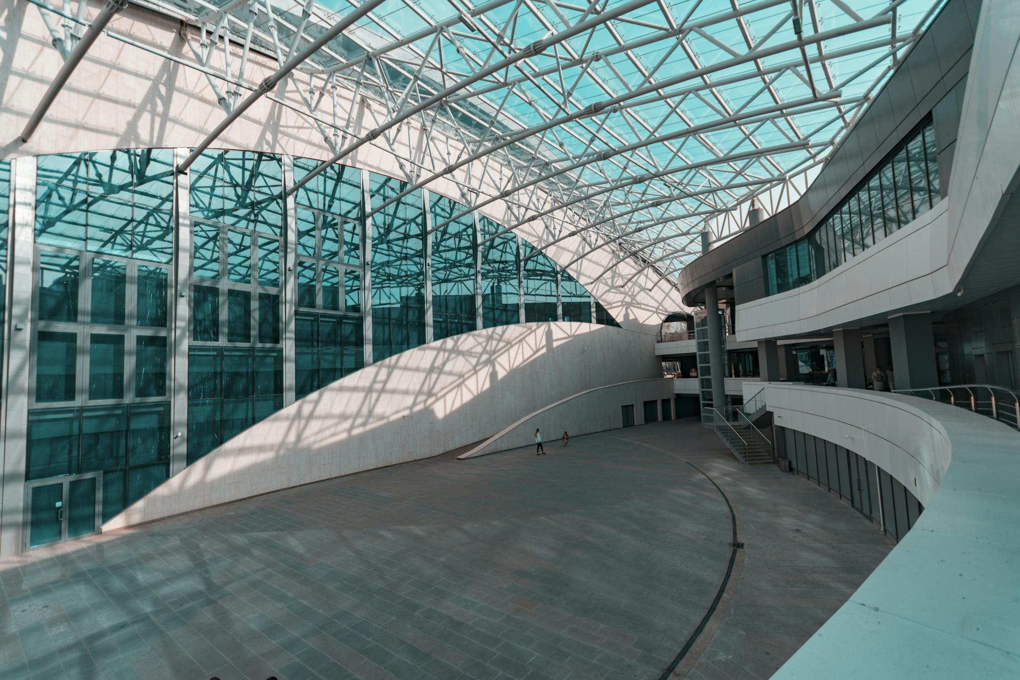 Person Walks Inside Glass Structure